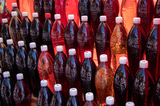 istock Bottles with handmade liqueur on the shelves. Alcoholic drinks from different berries and fruits 1341274073