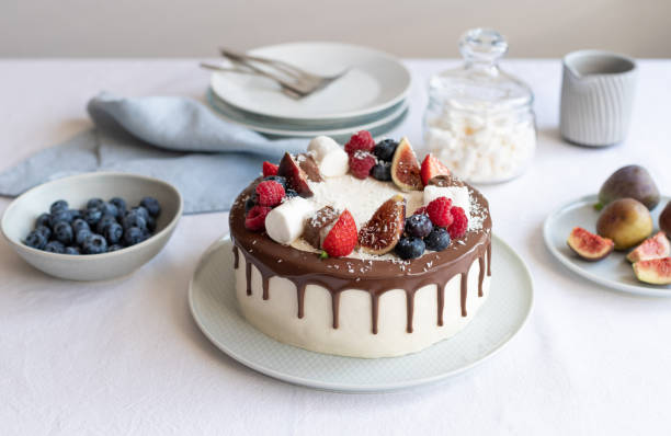 istock Delicious cake decorated with berries and chocolate 1341275218