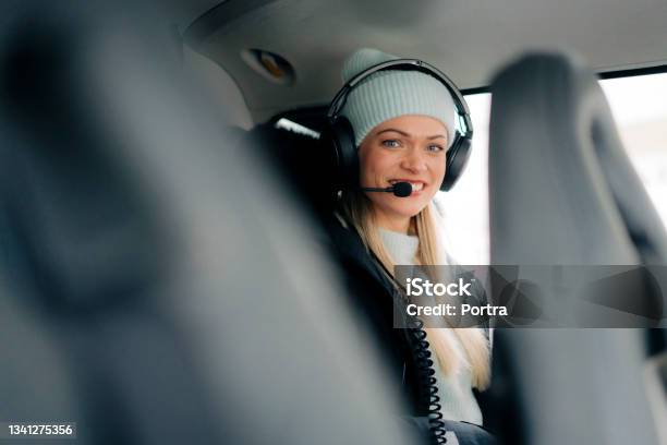 Woman Sitting In Helicopter Wearing Headset Stock Photo - Download Image Now - Aspirations, Pilot, Helicopter Pilot