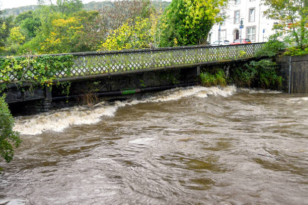 Treforest, near Pontypridd, Wales - October 2018: River water struggling to flow under a bridge on the River Taff in Treforest, South Wales, after a storm.