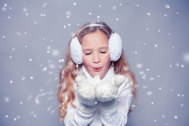 istock Girl in winter clothes 1341281123