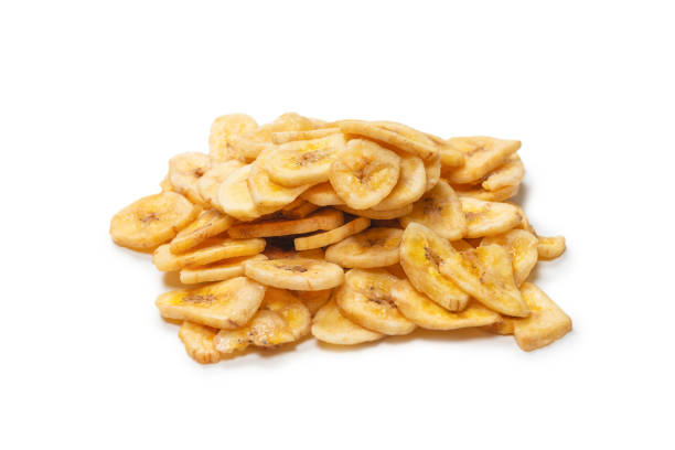 istock Banana chips isolated on a white background. Dehydrated banana. 1341281854