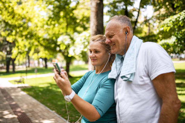 istock Senior couple making a selfie using smart phone in public park before jogging 1341282367