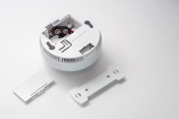 istock Smoke detector on a white background with an open battery compartment 1341282490