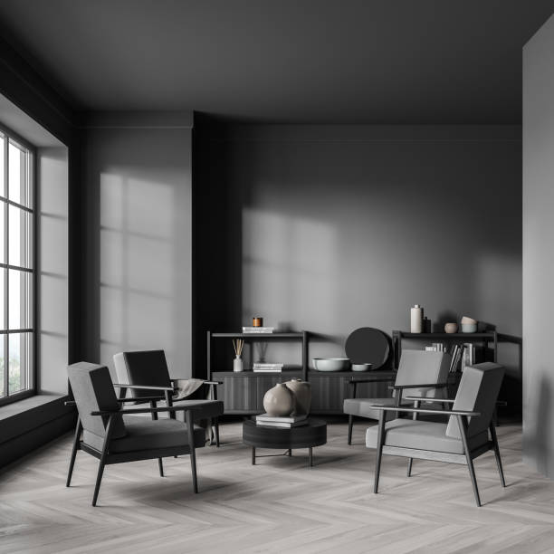 istock Four armchirs and coffee table in the dark grey waiting room 1341283167