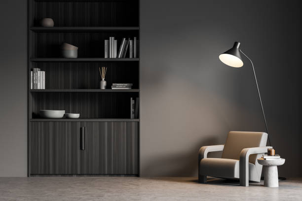 istock Waiting room wall with armchair and thin lamp, dark grey 1341283205