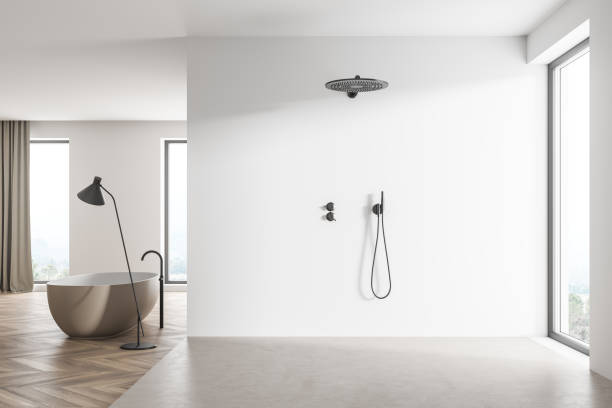 istock Spacious white shower room with panoramic windows and a beige bathtub 1341284487