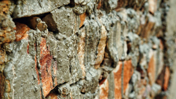 istock Rural India, Red bricks with cemented paste in a new house building. Selective focus 1341284749