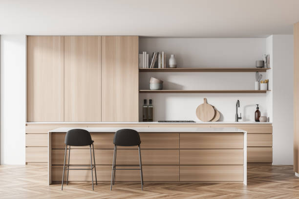 istock Light white kitchen cabinet with opened shelves and black stools 1341285076