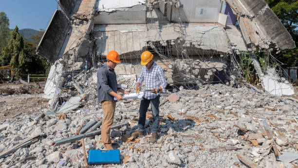 istock Demolition control supervisor and contractor discussing on demolish building. 1341285777