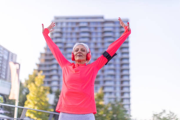 istock Senior athletic woman stretching outside 1341285814