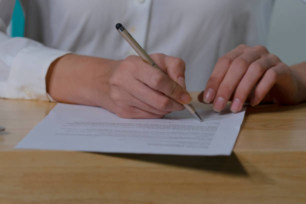 istock Woman is sign contract. 1341288408