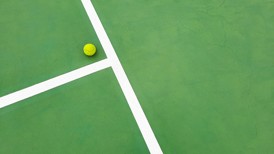 Directly above shot of yellow tennis ball on court