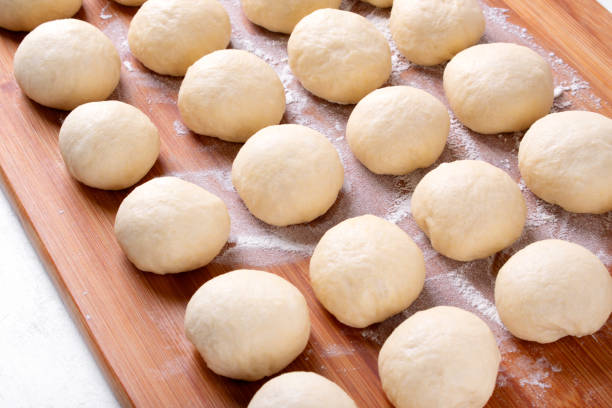 istock Yeast dough balls on the wooden board 1341292207
