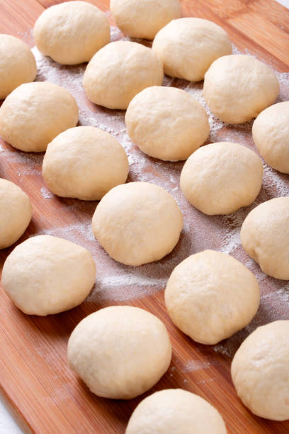 istock Yeast dough balls on the wooden board 1341292212