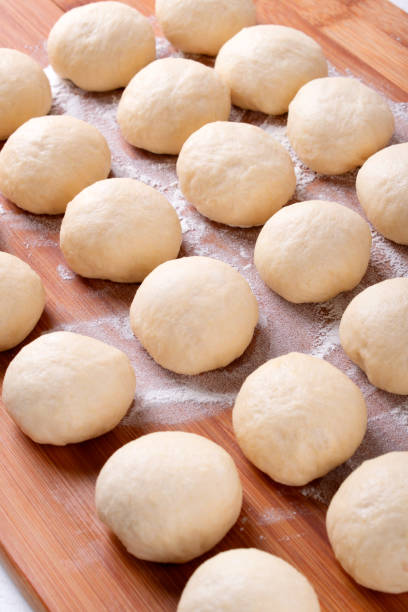 yeast dough balls on the wooden board - dough sphere kneading bread imagens e fotografias de stock