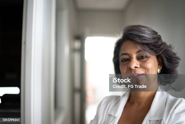 Portrait Of A Confident Female Doctor Stock Photo - Download Image Now - Doctor, One Woman Only, Portrait
