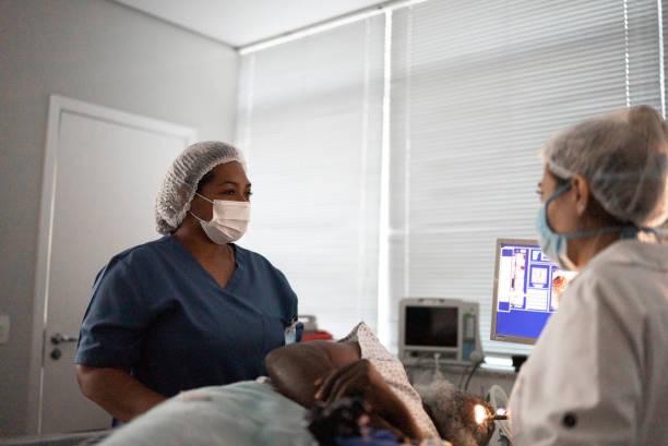 istock Doctor and nurse examining  or operating a patient 1341295307
