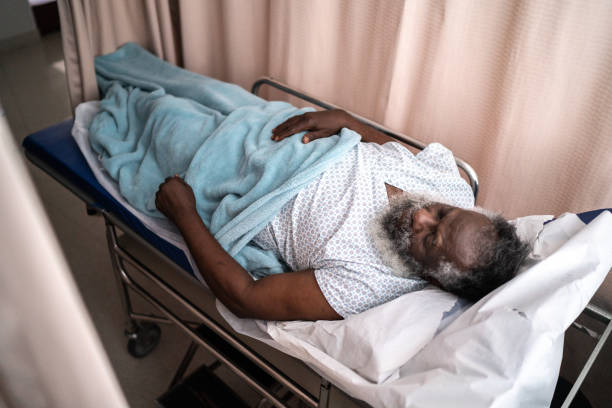 istock Senior patient lying down on hospital bed 1341295456