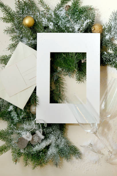 istock Christmas greeting card with fir tree in white frame 1341295579