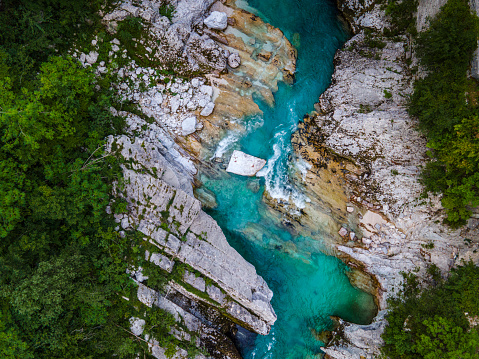 Wild Soca River Valley in Slovenia. Aerial Drone view Top Down. Summer Alpine Landscape.