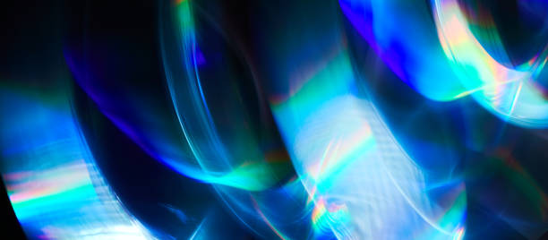 istock Blurred Light painting one exposure in camera. light glares with a spectral gradient on a dark background. Multicolored abstract colorful line. Unusual light effect. 1341299063