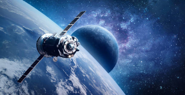 istock Russian spaceship on orbit of planet Earth. View from ISS station. Blue planets in deep space. Sci-fi wallpaper. Elements of this image furnished by NASA 1341299546