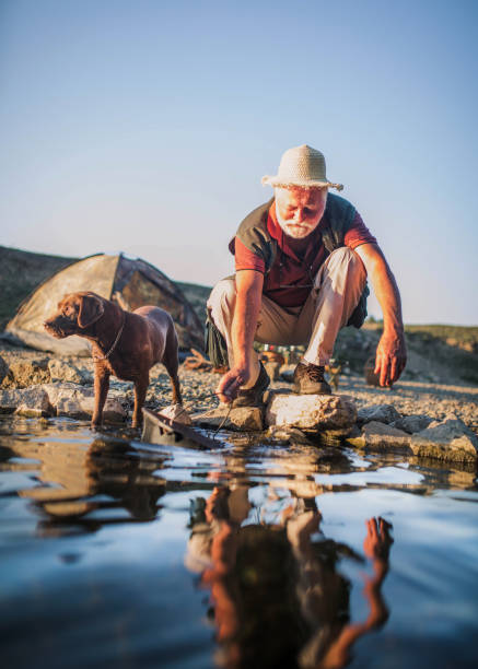 istock Senior couple enjoying on the river and having fun 1341300238