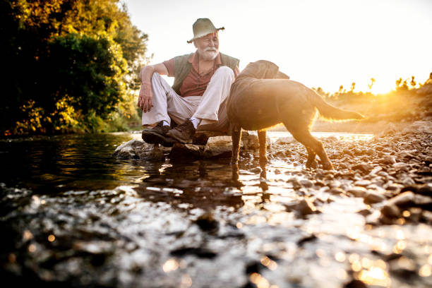 Senior couple enjoying on the river and having fun