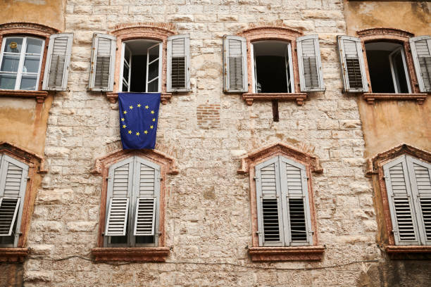 istock European Union flag hanging from window 1341301798