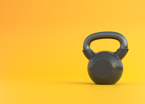 Black kettlebell on a yellow background. Front view. Gym and fitness workouts concept. Sport equipment. Workout tools. 3D render illustration