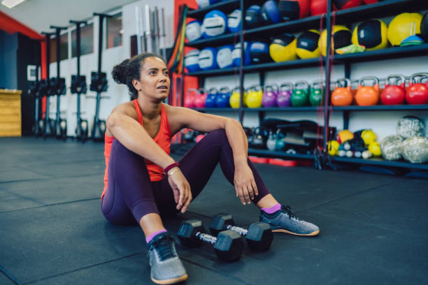 istock Exhausted sportswoman in the gym 1341302776