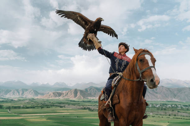 istock Eagle hunter on horse in steppe in Kyrgyzstan 1341309690