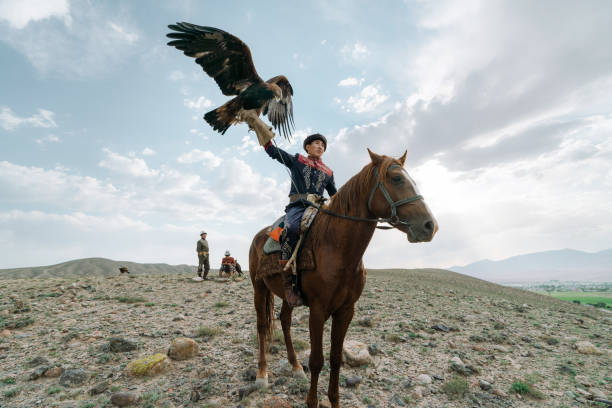 istock Eagle hunter on horse in steppe in Kyrgyzstan 1341309691