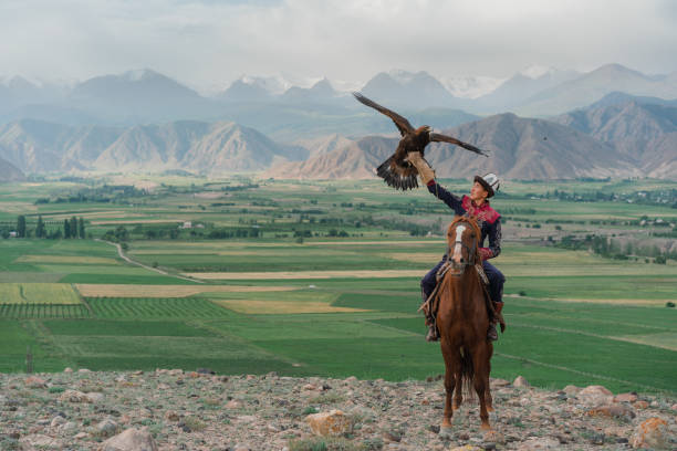istock Eagle hunter on horse in steppe in Kyrgyzstan 1341309917