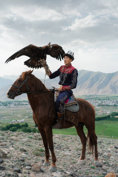 istock Eagle hunter on horse in steppe in Kyrgyzstan 1341309928