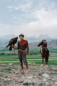 istock Two eagle hunters  in steppe in Kyrgyzstan 1341309939