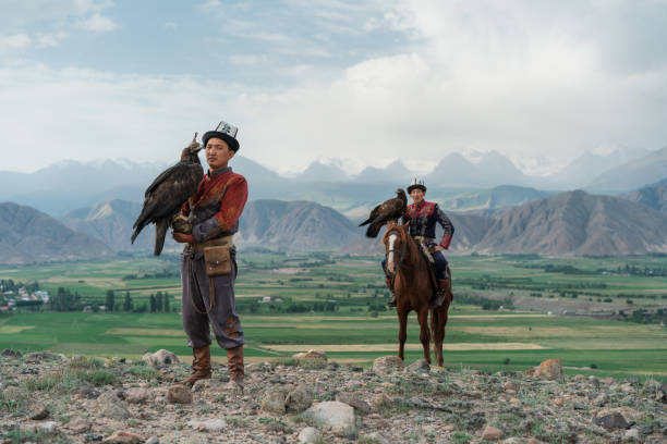 istock Two eagle hunters  in steppe in Kyrgyzstan 1341309942