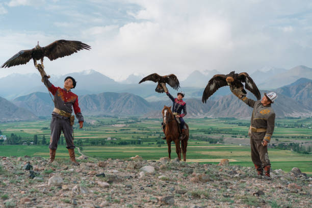 istock Three eagle hunters  in steppe in Kyrgyzstan 1341309959