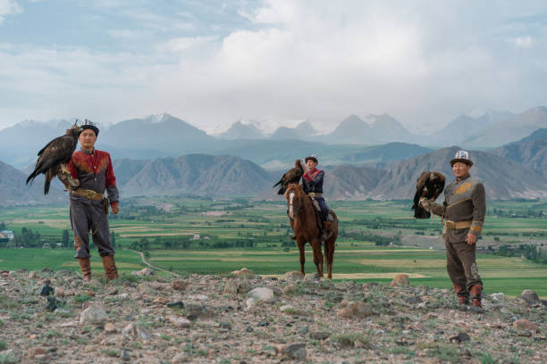 istock Three eagle hunters  in steppe in Kyrgyzstan 1341309960