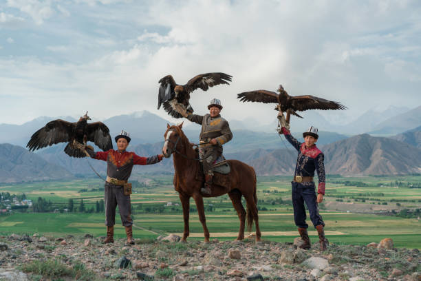 istock Three eagle hunters  in steppe in Kyrgyzstan 1341309973