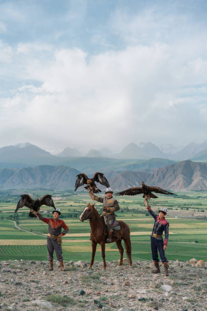 istock Three eagle hunters  in steppe in Kyrgyzstan 1341309975