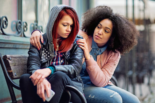 istock Young woman is consoling her crying girlfriend after break up 1341310549