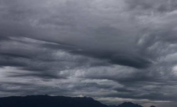 istock Dramatic Dark Cloudscape over Canadian Mountain Landscape 1341311404