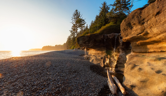 Unique Rock Formation at Sandcut Beach on the West Coast of Pacific Ocean. Summer Sunny Sunset. Canadian Nature Landscape Background. Located near Victoria, Vancouver Island, BC, Canada.