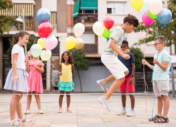 istock Kids playing together outdoors 1341311968