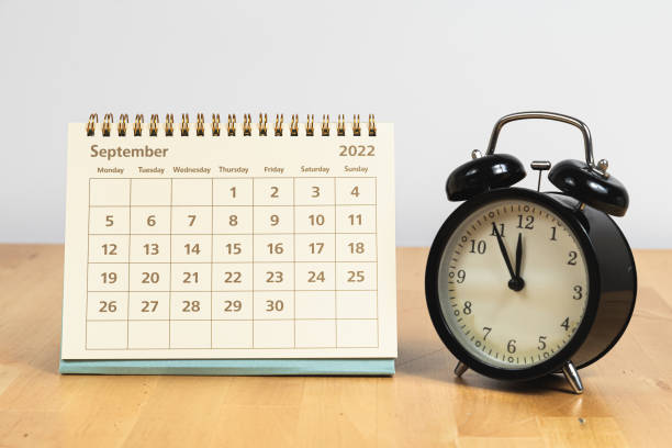September 2022 calendar and clock September 2022 calendar and vintage clock on a wooden table september calendar stock pictures, royalty-free photos & images