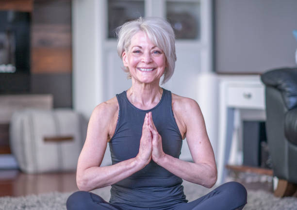 istock Senior Female Meditating 1341319800