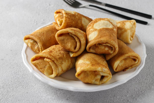 istock Homemade thin pancakes with cottage cheese for breakfast. Close-up 1341321856