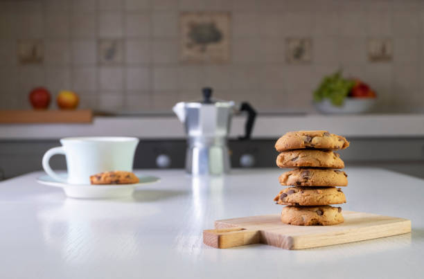 istock Stack of oatmeal cookies with chunks of chocolate lies on table 1341323664